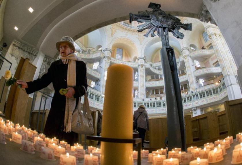 Memorials are laid in Dresden's Church of our Lady - rebuilt after the bombing  (Source: AFP)